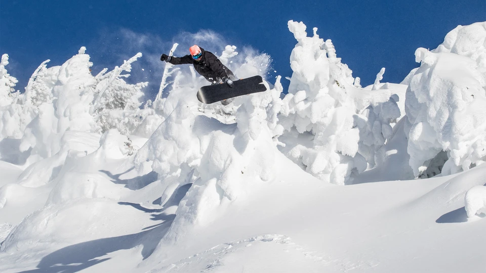 Snowboarder Grab off the Backside of Mt. Bachelor 
