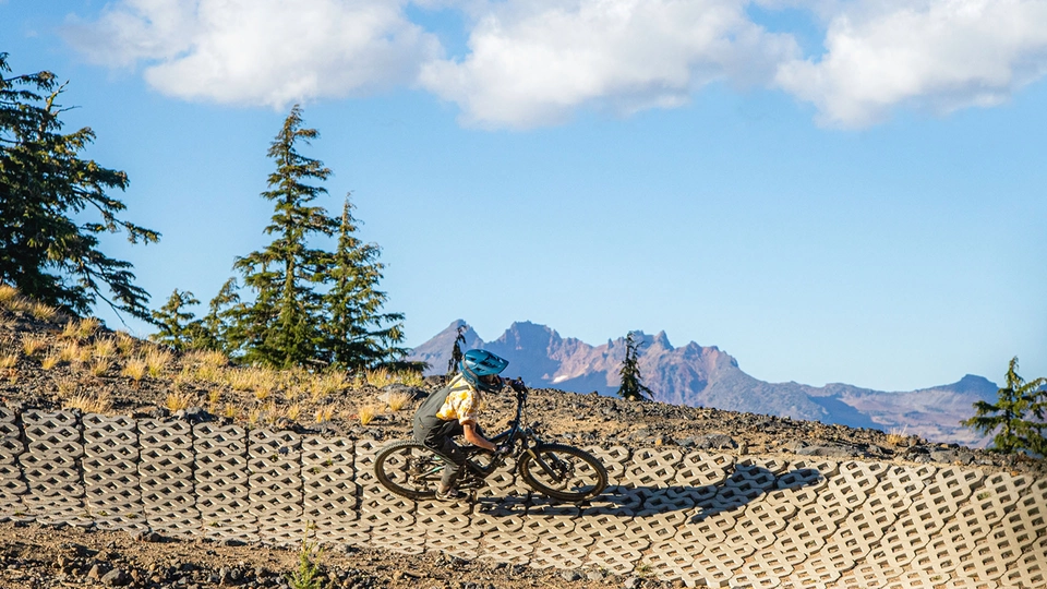 Rider in the Mt. Bachelor Bike Park with Cascade views